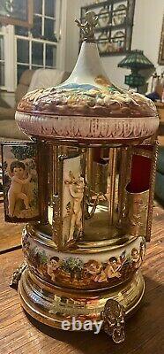 REUGE Capodimonte Porcelain Cherub Music Box Carousel cigarette Lipstick Holder