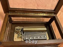 Reuge 3/72 beveled glass and wood music box, numbered and signed by the artist