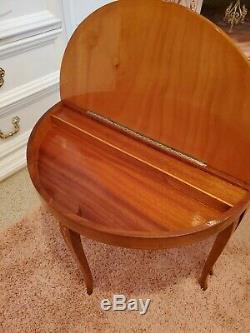 Reuge Musical Italian half moon table with marquetry and a music box