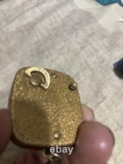 Reuge Swiss-made music box pendant with an ornate gold-plated blue cameo front