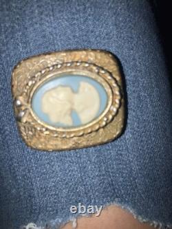 Reuge Swiss-made music box pendant with an ornate gold-plated blue cameo front