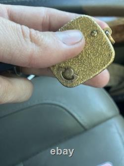 Reuge Swiss-made music box pendant with an ornate gold-plated blue cameo front