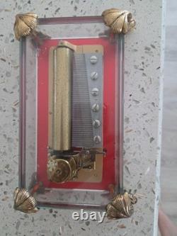 Reuge, glass cased, music box, made in Switzerland. In good condition