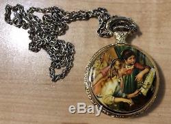 Reuge music box necklace Renoir Two Girls at the Piano. Plays Edelweiss. Gold pl