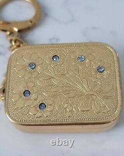VINTAGE Reuge Swiss Made Music Box Key Chain. Gold tone, Flowers with Blue Gems