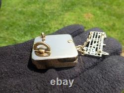 Vintage Swiss Reuge Miniature Music Box Gold Tone Case Musical Brooch