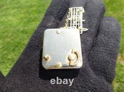 Vintage Swiss Reuge Miniature Music Box Gold Tone Case Musical Brooch