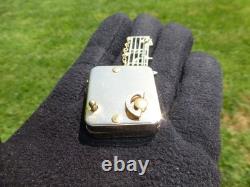 Vintage Swiss Reuge Miniature Music Box Gold Tone Case Musical Brooch
