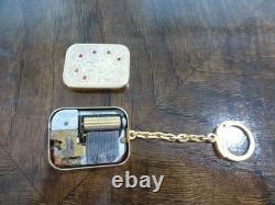 Vintage Swiss Reuge Miniature music box pendant, Key Chain, Ruby Stones Front