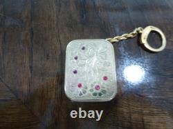 Vintage Swiss Reuge Miniature music box pendant, Key Chain, Ruby Stones Front